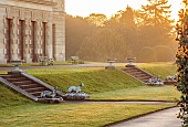BRODSWORTH HALL, YORKSHIRE: THE HALL AT DAWN, SUMMER, LAWNS, CLIPPED TOPIARY, STEPS, DOG STATUES