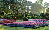 BRODSWORTH HALL, YORKSHIRE: SUMMER, CLIPPED TOPIARY HEDGES, HEDGING, BEDDING, LAWN, FORMAL BEDDING, TREES, VICTORIAN, MIST, FOG