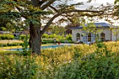 CHETTLE, DORSET: THE SWIMMING POOL AND POOL HOUSE, JUNE
