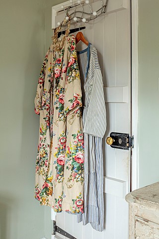 PEAR_TREE_COTTAGE_OXFORDSHIRE_MASTER_BEDROOM_FLORAL_COAT_KATHRYN_MADE_FROM_RECLAIMED_VINTAGE_CURTAIN