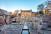 THE OLD RECTORY, QUINTON, NORTHAMPTONSHIRE: DESIGNER ANOUSHKA FEILER: RILL, SUMMERHOUSE, RECTORY, GRASSES, FROST, WINTER, FROSTY GARDEN, ENGLISH, COUNTRY, CHURCH, JANUARY