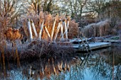 THE OLD RECTORY, QUINTON, NORTHAMPTONSHIRE: DESIGNER ANOUSHKA FEILER: GRASSES, FROST, WINTER, FROSTY GARDEN, ENGLISH, COUNTRY, JANUARY, WATER, POOL, POND, LAKE, DECKING