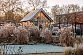 THE OLD RECTORY, QUINTON, NORTHAMPTONSHIRE: DESIGNER ANOUSHKA FEILER: GRASSES, FROST, WINTER, GARDEN, ENGLISH, COUNTRY, JANUARY, MISCANTHUS KLEINE FONTAINE, HEDGES, SUMMERHOUSE