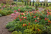 PATTHANA GARDEN, IRELAND: MAY, THE NEW TORC GARDEN MADE IN 2020, TULIPS, SPRING, MAY, PINK CHAIRS,GRAVEL PATHS, METAL GATE, FIELD