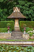 THE SUMMERHOUSE, OXFORDSHIRE: JULY, SUMMER, GARDEN, BORDERS, TREES, STONE DOVECOTE, YEW HEDGES, HEDGING, PEROVSKIA, COTSWOLDS, STEPS, URNS, CONTAINERS