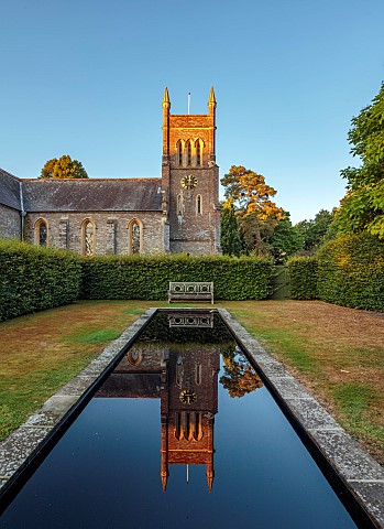 STOCKCROSS_HOUSE_BERKSHIRE_LONG_BLACK_POOL_RILL_WITH_CHURCH_REFLECTED_IN_IT_REFLECTIONS