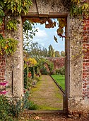 BOWOOD HOUSE & GARDENS, WILTSHIRE: THE WALLED GARDEN, AUTUMN, OCTOBER, FALL, BORDERS, PATHS, WALLS, GATEWAY, VIEW THROUGH