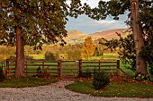 THE LAUNDRY GARDEN, DENBIGH, WALES: NOVEMBER, COUNTRYSIDE, GATE, FENCE, FENCES, SUNSET, PATHS