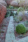 ORDNANCE HOUSE, WILTSHIRE: FROST, FROSTY, WINTER, BEECH, HEDGE, HEDGING, GRASS PATH, FOCAL POINT, STATUE, BORDERS, FORMAL, COUNTRY, GARDEN
