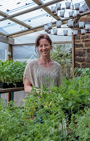 BROWN_FLOWERS_OXFORDSHIRE_ANNA_BROWN_IN_HER_CONSERVATORY_WITH_SEEDLINGS