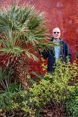 THE PALM CENTRE, LONDON: MARCH, OWNER MARTIN GIBBONS BESIDE A PALM