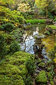 IFORD MANOR, WILTSHIRE: APRIL: THE JAPANESE GARDEN, WATER, MOSS, POOL, POND, CHERRY TREE, JAPAN, ROCKS