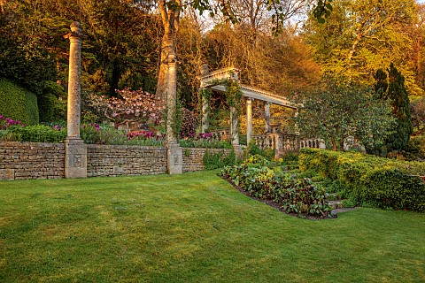 IFORD_MANOR_WILTSHIRE_APRIL_SUNSET_TOP_ERRACE_LAWN_COLUMNS_CHERRY
