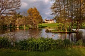 FOSCOTE MANOR, BUCKINGHAMSHIRE: APRIL, SPRING, THE LAKE AND VIEW TO MANOR HOUSE, ROMANTIC, LANDSCAPE