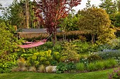 DESIGNER JAMES SCOTT, THE GARDEN COMPANY: SMALL, TOWN, GARDEN, SEATING, SEAT, SWING SEAT, HAMMOCKS, LAWN, BORDERS, MAY, EUPHORBIA, FENCES, FENCING