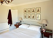 PRIVATE GARDEN, DEDHAM VALE, SUFFOLK: MASTER BEDROOM , WALLS PAINTED IN AMMONITE BY FARROW & BALL, VICTORIAN TINSEL PRINTS