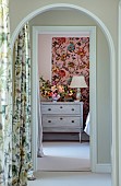 PRIVATE GARDEN, DEDHAM VALE, SUFFOLK: VIEW ALONG LANDING TO GUEST BEDROOM, WALLS PAINTED CUISSE DE NYMPHE BY EDWARD BULMER, ARTEMIS WALLPAPER BY HOUSE OF HACKNEY