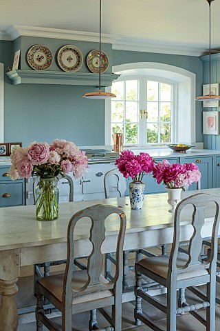PRIVATE_GARDEN_DEDHAM_VALE_SUFFOLK_KITCHEN_TABLE_REPRODUCTION_OF_A_FRENCH_MONASTERY_TABLE_PINK_PEONI