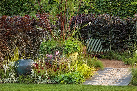 HAMPTON_COURT_2023_DESIGNER_LUCY_TAYLOR_TRADITIONAL_TOWNHOUSE_GARDEN_STONE_PATH_METAL_SEATS_CONTAINE