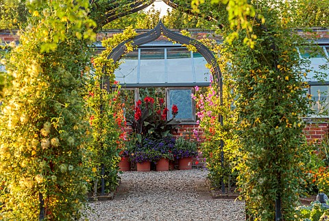 MORTON_HALL_GARDENS_WORCESTERSHIRE_JULY_KICHEN_GARDENS_POTAGER_VEGETABLE_ARCH_CONTAINERS_WITH_CANNAS