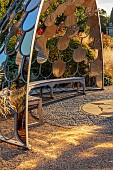 GRANTLEY HALL, YORKSHIRE: SUNSET, GRAVEL GARDEN, PATINATED STEEL AND COLOURED STAINLESS STEEL GLAZED CUPOLA SEAT, SEPTEMBER