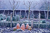 WINTER IN THE VEGETABLE GARDEN WITH TERRACOTTA FORCING POTS AT CHENIES MANOR GARDEN  BUCKINGHAMSHIRE