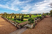 BOWOOD HOUSE AND GARDENS, WILTSHIRE: THE ITALIAN INSPIRED TERRACE GARDEN, YEW, TOPIARY, OCTOBER, FALL, AUTUMN, GRASS, FORMAL, PATHS