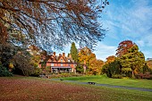 HERGEST CROFT GARDENS, HEREFORDSHIRE: FALL, AUTUMN, NOVEMBER, LAWN, THE EDWARDIAN HOUSE
