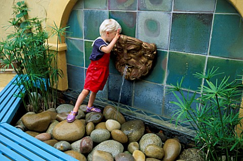 ROBERT_STANDING_ON_THE_CHILD_PROOF_WATER_FEATURE_THE_NICHOLS_GARDEN__READING