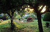 HAMMOCK IN SHADY SPOT BETWEEN TWO CRAB APPLE TREES LITTLE COURT  HANTS. (THIS IS A CHALKY/ALKALINE GARDEN)