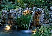 WATERFALLS WITH LIGHTING BY GARDEN & SECURITY LIGHTING. DESIGN BY NATURAL & ORIENTAL WATER GARDENS