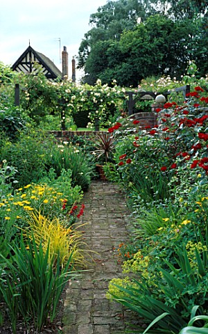 THE_RED_GARDEN_WITH_PATH_LEADING_TO_THE_HOUSE_IN_THE_BACKGROUND_WOLLERTON_OLD_HALL__SHROPSHIRE