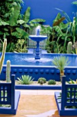COURTYARD WITH BLUE FOUNTAIN IN FRONT OF TILE MOSAIC IN THE MOROCCAN STYLE YVES ST. LAURENT GARDEN DESIGNED BY MADISON COX. CHELSEA 97