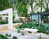 STEEL AND GLASS PAVILION SURROUNDED BY MEDITERRANEAN STYLE PLANTING IN DAILY TELEGRAPH GARDEN. DESIGNER: CHRISTOPHER BRADLEY-HOLE