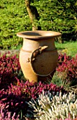 TERRACOTTA URN AS FOCAL POINT SURROUNDED BY WINTER FLOWERING HEATHER   LITTLE COOPERS  HAMPSHIRE