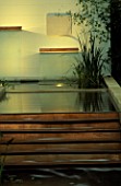 SIMPLE WATER FEATURE BY BARBARA HUNT  WITH LIGHTING BY GARDEN & SECURITY LIGHTING. THE NATURAL AND ORIENTAL WATER GARDEN  HAMPTON COURT 97