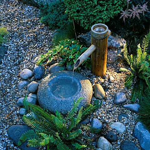 JAPANESE_WATER_FEATURE_BAMBOO_WATER_SPOUT_INTO_STONE_BOWL__LIGHTING_BY_GARDEN__SECURITY_LIGHTING_NAT