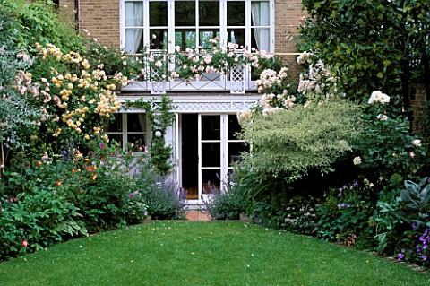 VIEW_ONTO_TOWN_GARDEN_WITH_LAWN_ROSES_BUFF_BEAUTY__PENELOPEON_THE_BALCONY_IS_ROSE_NEW_DAWN_AND_ON_TH
