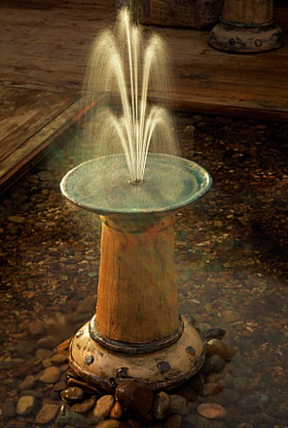 CERAMIC_FOUNTAIN_BY_EMMA_LUSH_LIT_UP_AT_NIGHT