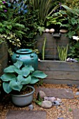 WATER FEATURE WITH BLUE CERAMIC POT AND CONTAINER WITH HOSTAS. CHELSEA 98