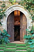 TROMPE LOEIL PAINTING BEHIND WOODEN DOORS AND STONE ARCH. CHELSEA 98