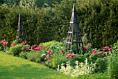 TULIP MAY TIME WITH BLUE OBELISKS IN THE SUMMERHOUSE GARDEN.ARROW COTTAGE  HEREFORDSHIRE