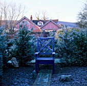 ARROW COTTAGE ON A FROSTY MORNING WITH A BLUE WOODEN SEAT