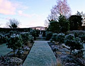 EARLY MORNING FROSTY VIEW ACROSS THE GREEN GARDEN TO THE HILLS BEYOND.  ARROW COTTAGE  HEREFORDSHIRE