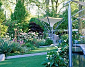 MODERN GARDEN CONTAINING ARCHITECTURAL FORM AND CANVAS CANOPY WITH STEPPED LAWN AND CANAL. TELEGRAPH REFLECTIVE GARDEN  CHELSEA 99.