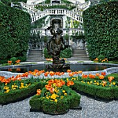 FOUNTAIN  STAIRCASE AND BOX BEDS FILLED WITH TULIP ORANGE FAVOURITE. THE VILLA CARLOTTA  LAKE COMO  ITALY