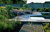 PERENNIAL PLANTING IN WALLED GARDEN BY CHRISTOPHER BRADLEY-HOLE: SWIMMING POOL WITH STEPS SURROUNDED BY DECKING AND SCYNARA CARDUNCULUS  STIPA BARBATA  NEPETA SIX HILLS GIANT