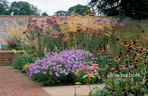 PERENNIAL_PLANTING_IN_WALLED_GARDEN_BY_CHRISTOPHER_BRADLEYHOLE_ASTER_X_FRIKARTII_MONCH_STIPAS_GIGANT