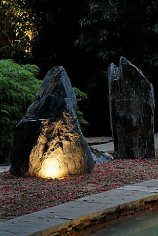 NATURAL_ROCKS_LIT_FROM_BELOW_WITH_RAKED_GRAVEL_AND_BAMBOO_THE_ZEN_INSPIRED_GARDEN_DESIGNED_BY_SPIDER