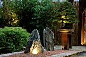 NATURAL ROCKS LIT FROM BELOW WITH RAKED GRAVEL  PINUS BONSAI & BAMBOO. THE ZEN INSPIRED GARDEN. DES: SPIDERGARDEN.COM  LIGHTING BY COTSWOLD ELECTRICAL. CHELSEA 2000
